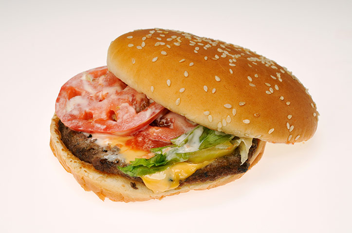 Burger King Whopper Cheeseburger with tomato lettuce and mayonnaise on bun