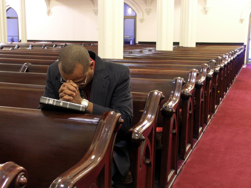 black_man_praying_in_church